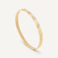 Bangle in oro giallo e spot di diamanti